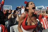 Paraguayan model Larissa Riquelme and other fans watch a public screening of the World Cup soccer match between Paraguay and Spain at Defensores del Chaco Stadium in Asuncion, on July 3, 2010.  AFP PHOTO/Norberto DUARTE.<!-- NICAID(5296014) -->