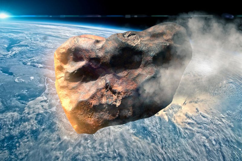 Imagem que ilustra um asteroide se aproximando da Terra<!-- NICAID(15412242) -->