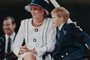 Princess Diana (R) and her son Harry watch the march past on a dais on the mall as part of the commemorations of VJ Day on August 19, 1995. - The commemoration was held outside Buckingham Palace and was attended by 15,000 veterans and tens of thousands of spectators. (Photo by Johnny EGGITT / AFP)Editoria: HUMLocal: LondonIndexador: JOHNNY EGGITTSecao: societyFonte: AFPFotógrafo: STF<!-- NICAID(15192361) -->