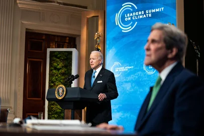 WASHINGTON, DC - APRIL 23: U.S. President Joe Biden delivers remarks as Special Presidential Envoy for Climate and former Secretary of State John Kerry listens during day 2 of the virtual Leaders Summit on Climate at the East Room of the White House April 23, 2021 in Washington, DC. Biden pledged to cut greenhouse gas emissions by half by 2030.   Anna Moneymaker-Pool/Getty Images/AFP (Photo by POOL / GETTY IMAGES NORTH AMERICA / Getty Images via AFP)<!-- NICAID(14765083) -->