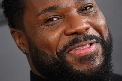 (FILES) US actor Malcolm-Jamal Warner arrives for the 65th Annual Grammy Awards at the Crypto.com Arena in Los Angeles on February 5, 2023. Warner, who played the son in the smash-hit sitcom "The Cosby Show," has drowned in Costa Rica, authorities in the country said on July 21, 2025. He was 54. Warner played the loveable Theo Huxtable for all eight seasons of the show, helmed by disgraced comic actor Bill Cosby. (Photo by Robyn BECK / AFP)<!-- NICAID(16085134) -->