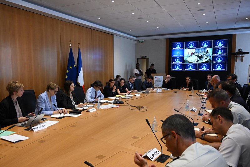 French Foreign and European Affairs Minister's cabinet director Luis Vassy (4th L) delivers a speech during a meeting on the ongoing situation in Niger following the coup, at the French Foreign and European Affairs Ministry in Paris on August 1, 2023. France prepared to evacuate its citizens from Niger on August 1, 2023, as tensions escalated following last week's coup that toppled one of the last remaining pro-Western leaders in Africa's impoverished and jihadist-plagued Sahel region. (Photo by STEFANO RELLANDINI / AFP)<!-- NICAID(15497155) -->