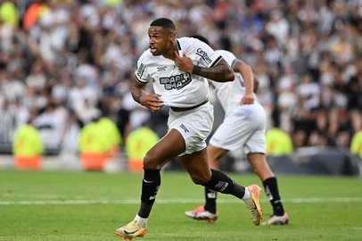 Botafogo's forward #11 Junior Santos celebrates after scoring his team third goal during the Copa Libertadores final football match between Brazilian teams Atletico Mineiro and Botafogo at the Mas Monumental Stadium in Buenos Aires on November 30, 2024.