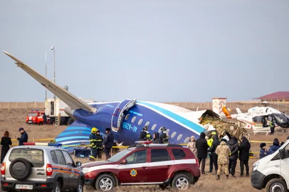 Emergency specialists work at the crash site of an Azerbaijan Airlines passenger jet near the western Kazakh city of Aktau on December 25, 2024. (Photo by Issa Tazhenbayev / AFP)<!-- NICAID(15941981) -->