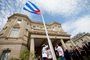 Cuban flag raised over Havana's embassy in WashingtonCuban Foreign Minister Bruno Rodriguez(4th-L) applauds after raising the Cuban flag over their new embassy in Washington, DC July 20, 2015. Cuba's blue, red and white-starred flag was hoisted Monday at the country's embassy in Washington in a symbolic move signaling the start of a new post-Cold War era in U.S.-Cuba relations. AFP PHOTO / POOL / ANDREW HARNIKEditoria: POLLocal: WashingtonIndexador: Andrew HarnikSecao: DiplomacyFonte: POOLFotógrafo: POOL<!-- NICAID(11559288) -->
