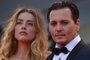 (FILES) In this file photo taken on September 04, 2015 US actor Johnny Depp and his wife US actress Amber Heard arrive for screening of the movie "Black Mass" presented out of competition at the 72nd Venice International Film Festival at Venice Lido. - A US jury on June 1, 2022found Johnny Depp and Amber Heard defamed each other, but sided far more strongly with the "Pirates of the Caribbean" star following an intense libel trial involving bitterly contested allegations of sexual violence and domestic abuse. (Photo by TIZIANA FABI / AFP)<!-- NICAID(15119251) -->