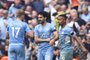 Manchester City's German midfielder Ilkay Gundogan (C) celebrates with teammates after scoring his team third goal during the English Premier League football match between Manchester City and Aston Villa at the Etihad Stadium in Manchester, north west England, on May 22, 2022. (Photo by Oli SCARFF / AFP) / RESTRICTED TO EDITORIAL USE. No use with unauthorized audio, video, data, fixture lists, club/league logos or 'live' services. Online in-match use limited to 120 images. An additional 40 images may be used in extra time. No video emulation. Social media in-match use limited to 120 images. An additional 40 images may be used in extra time. No use in betting publications, games or single club/league/player publications. / Editoria: SPOLocal: ManchesterIndexador: OLI SCARFFSecao: soccerFonte: AFPFotógrafo: STR<!-- NICAID(15103395) -->