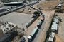 In this aerial view, a convoy of lorries carrying humanitarian aid enters the Gaza Strip from Egypt via the Rafah border crossing on October 21, 2023. The first of 20 trucks carrying humanitarian aid entered the war-torn and besieged Gaza Strip on October 21 through the Rafah border crossing with Egypt, said AFP correspondents on both sides. (Photo by Mohammed ABED / AFP)<!-- NICAID(15575536) -->