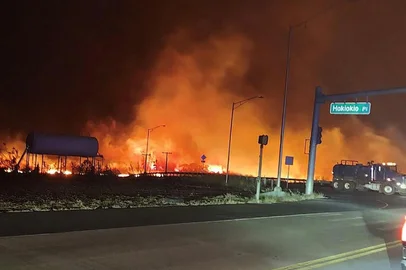 In this image obtained from the County of Maui in Hawaii, shows a wildfire in Lahaina, on August 9, 2023. Hawaii wildfires fanned by winds from Hurricane Dora forced evacuation late on August 8. The National Weather service reported that Dora, 500 miles (805kms) south of Hawaii was partly to blame for wind gusts above 60mph (97kph). (Photo by Zeke Kalua / County of Maui / AFP) / RESTRICTED TO EDITORIAL USE - MANDATORY CREDIT "AFP PHOTO / Zeke Kalua / County of Maui" - NO MARKETING NO ADVERTISING CAMPAIGNS - DISTRIBUTED AS A SERVICE TO CLIENTS<!-- NICAID(15506375) -->