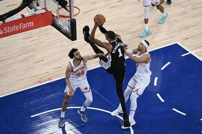SAUL LOEB / AFP San Antonio Spurs' French forward-center #01 Victor Wembanyama shoots the ball while being defended by Knicks guard #44 Landry Shamet and Knick guard #03 Josh Hart during Game Three of the NBA Finals between the San Antonio Spurs and the New York Knicks at Madison Square Garden in New York on June 8, 2026. (Photo by SAUL LOEB / AFP)<!-- NICAID(16302392) -->