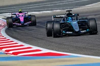 Mercedes' British driver George Russell drives ahead of Alpine's Argentine driver Franco Colapinto on the third day of the Formula One pre-season testing at the Bahrain International Circuit in Sakhir on February 13, 2026. (Photo by Giuseppe CACACE / AFP)<!-- NICAID(16225050) -->
