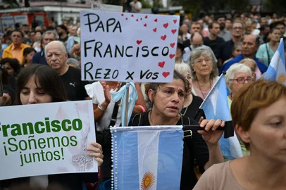 Faithful Catholics attend a mass for Pope Francis's healing in Constitution Square, the place where, when he was archbishop of Buenos Aires he gave annual masses to denounce exclusion and human trafficking in Buenos Aires, on February 24, 2025. Pope Francis, hospitalized due to bilateral pneumonia, remains in critical condition but is showing "slight improvement," the Vatican announced Monday night, as concern grows for the 88-year-old Argentine pontiff. (Photo by Luis ROBAYO / AFP)<!-- NICAID(15983359) -->