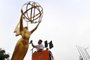 Painter Eddie Garcia touches up a statue of the Emmy Award on September 12, 2017 in Los Angeles, ahead of this weekend's 69th Emmy Awards.  / AFP PHOTO / FREDERIC J. BROWN<!-- NICAID(13149720) -->