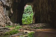 A cave entrance in the Peruaçu Caves National Park, home to a group of more than 250 caves with rock paintings dating back approximately 12,000 years, in the municipality of Itacarambi, Minas Gerais State, Brazil , on January 9, 2025. The United Nations Educational, Scientific and Cultural Organization (UNESCO) declared the Peruacu Caves National Park a World Natural Heritage Site on July 13, 2025 during a session of the World Heritage Committee in Paris. (Photo by Evandro Pereira / AFP)<!-- NICAID(16080088) -->
