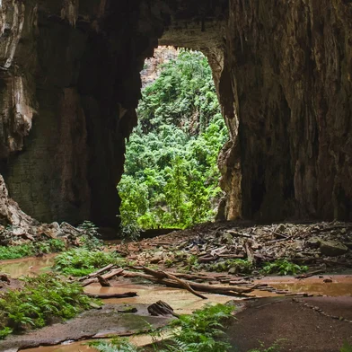 A cave entrance in the Peruaçu Caves National Park, home to a group of more than 250 caves with rock paintings dating back approximately 12,000 years, in the municipality of Itacarambi, Minas Gerais State, Brazil , on January 9, 2025. The United Nations Educational, Scientific and Cultural Organization (UNESCO) declared the Peruacu Caves National Park a World Natural Heritage Site on July 13, 2025 during a session of the World Heritage Committee in Paris. (Photo by Evandro Pereira / AFP)<!-- NICAID(16080088) -->