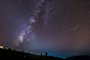 Long time exposure night landscape with the milky way during meteor shower over a mountain with hut.Indexador: Suriyan  TejasurintrFonte: 296262015<!-- NICAID(14358824) -->