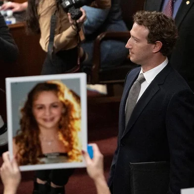 Mark Zuckerberg, CEO of Meta, walks past the photo of a victim of child exploitation as he arrives for a full committee hearing on "Big Tech and the Online Child Sexual Exploitation Crisis at the Dirksen Senate Office Building on Capitol Hill in Washington, DC, on January 31, 2024. (Photo by ROBERTO SCHMIDT / AFP)<!-- NICAID(15666189) -->