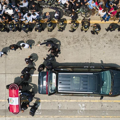 The coffin of late Peru's former president Alberto Fujimori arrives for his wake at the Culture Ministry in Lima on September 12, 2024. Peru's former president Alberto Fujimori, who ruled his country with an iron fist and then spent 16 years in prison for crimes against humanity, died on Wednesday at age 86 in the capital Lima. (Photo by Juan Carlos CISNEROS / AFP)<!-- NICAID(15865512) -->
