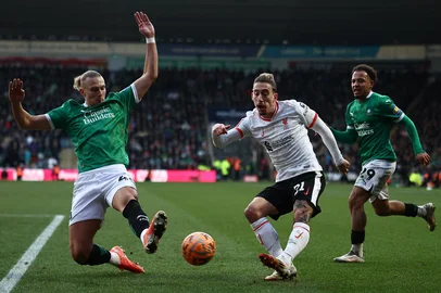 Plymouth's Ukrainian defender #40 Maksym Talovyerov (L) defends a cross from Liverpool's Greek defender #21 Kostas Tsimikas during the English FA Cup fourth round football match between Plymouth Argyle and Liverpool at Home Park in Plymouth, south west England, on February 9, 2025. (Photo by HENRY NICHOLLS / AFP) / RESTRICTED TO EDITORIAL USE. No use with unauthorized audio, video, data, fixture lists, club/league logos or 'live' services. Online in-match use limited to 120 images. An additional 40 images may be used in extra time. No video emulation. Social media in-match use limited to 120 images. An additional 40 images may be used in extra time. No use in betting publications, games or single club/league/player publications. / <!-- NICAID(15972412) -->