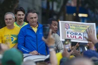 Brazil's former President Jair Bolsonaro (3rd L) leaves a rally on Paulista Avenue in Sao Paulo, Brazil, on June 29, 2025. Former Brazilian President Jair Bolsonaro called on his supporters on Sunday to demonstrate in Sao Paulo in the name of "justice," as he faces the threat of spending several decades in prison for an alleged coup attempt. (Photo by Miguel SCHINCARIOL / AFP)<!-- NICAID(16069853) -->