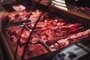 Meat market's fridge with different meat productsButcher shop's counter with cold raw meat. Meat business. Selected quality meat selling.                 Fonte: 370417090<!-- NICAID(15310411) -->