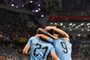 Uruguay's forward Edinson Cavani (L) is congratulated by teammates after scoring the opening goal during the Russia 2018 World Cup round of 16 football match between Uruguay and Portugal at the Fisht Stadium in Sochi on June 30, 2018. / AFP PHOTO / Jonathan NACKSTRAND / RESTRICTED TO EDITORIAL USE - NO MOBILE PUSH ALERTS/DOWNLOADS<!-- NICAID(13626395) -->