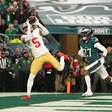 PHILADELPHIA, PENNSYLVANIA - JANUARY 11: Demarcus Robinson #5 of the San Francisco 49ers catches a touchdown against Quinyon Mitchell #27 of the Philadelphia Eagles during the first quarter in the NFC Wild Card Playoff game at Lincoln Financial Field on January 11, 2026 in Philadelphia, Pennsylvania.   Mitchell Leff/Getty Images/AFP (Photo by Mitchell Leff / GETTY IMAGES NORTH AMERICA / Getty Images via AFP)<!-- NICAID(16203821) -->