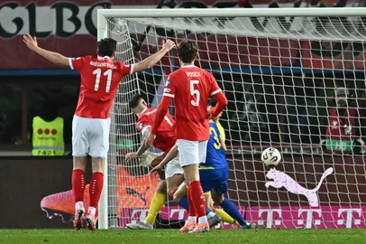 Austria's forward #11 Michael Gregoritsch (L) celebrates scoring the equalizer during the FIFA World Cup 2026 European qualification Group H football match between Austria and Bosnia and Herzegovina, in Vienna on November 18, 2025. (Photo by Joe Klamar / AFP)<!-- NICAID(16169843) -->