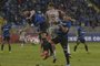 Huachipato's defender Benjamin Gazzolo (L) and Estudiantes's defender Federico Fernandez (C) fight for the ball during the Copa Libertadores group stage first leg football match between Chile's Huachipato and Argentina's Estudiantes de La Plata at the Huachipato Stadium in Talcahuano, Chile, on April 3, 2024. (Photo by Guillermo SALGADO / AFP)<!-- NICAID(15724861) -->