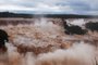 View of the Iguazu Falls, which are completely covered by the river's strong current on the triple border between Brazil, Argentina and Paraguay, on October 30, 2023. The Falls are flowing at over 24 million liters of water per second, according to hydrological monitoring by Companhia Paranaense de Energia (Copel). This is the second highest flow since 1997, when monitoring became automatic and was measured hourly. (Photo by Christian Rizzi / AFP)<!-- NICAID(15587978) -->