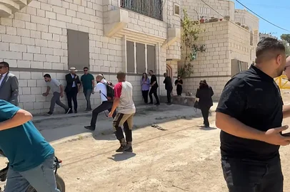 This frame grab from AFPTV footage shows members of a diplomatic delegation from the European Union reacting after shots were fired as they gathered in the eastern entrance of Jenin camp during a visit to the city of Jenin, on May 21, 2025, amid an ongoing Israeli military offensive in the occupied West Bank. The Palestinian Authority accused Israeli forces of firing on diplomats as they visited the flashpoint West Bank city of Jenin on May 21, releasing video of two soldiers aiming rifles at a group of people. (Photo by Mohammad Ateeq / AFPTV / AFP)<!-- NICAID(16042801) -->
