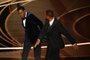 US actor Will Smith (R) slaps US actor Chris Rock onstage during the 94th Oscars at the Dolby Theatre in Hollywood, California on March 27, 2022. (Photo by Robyn Beck / AFP)<!-- NICAID(15053226) -->