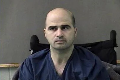HANDOUT / BELL COUNTY SHERIFFS DEPARTMENT (FILES) This April 9, 2010 file photo released by the Bell County Sheriffs Department, shows US Major Nidal Hasan after being moved from Brooke Army Medical Center in San Antonio to Bell County Jail in Belton, Texas. US Defense Secretary Pete Hegseth said the firing squad execution of convicted military base shooter Nidal Hasan will be "public," according to a video publicized by the Pentagon on October 8, 2026. (Photo by Handout / BELL COUNTY SHERIFFS DEPARTMENT / AFP) / RESTRICTED TO EDITORIAL USE - MANDATORY CREDIT "AFP PHOTO /BELL COUNTY SHERIFFS DEPARTMENT " - HANDOUT - NO MARKETING NO ADVERTISING CAMPAIGNS - DISTRIBUTED AS A SERVICE TO CLIENTS<!-- NICAID(16383638) -->