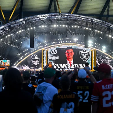 PITTSBURGH, PENNSYLVANIA - APRIL 23: A detailed view of the stage showing a still of Fernando Mendoza of the Indiana on screen after being selected first overall pick by the Las Vegas Raiders during Round One of the 2026 NFL Draft at Acrisure Stadium on April 23, 2026 in Pittsburgh, Pennsylvania.   Jason Miller/Getty Images/AFP (Photo by Jason Miller / GETTY IMAGES NORTH AMERICA / Getty Images via AFP)<!-- NICAID(16272001) -->