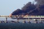 -- AFP PICTURES OF THE YEAR 2022 --Black smoke billows from a fire on the Kerch bridge that links Crimea to Russia, after a truck exploded, near Kerch, on October 8, 2022. - Moscow announced on October 8, 2022 that a truck exploded igniting a huge fire and damaging the key Kerch bridge -- built as Russia's sole land link with annexed Crimea -- and vowed to find the perpetrators, without immediately blaming Ukraine. (Photo by AFP) / AFP PICTURES OF THE YEAR 2022Editoria: WARLocal: KerchIndexador: -Secao: fireFonte: AFPFotógrafo: STR<!-- NICAID(15280749) -->