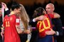 (FILES) Spain's defender #20 Rocio Galvez is congratuled by President of the Royal Spanish Football Federation Luis Rubiales (R) next to Spain's Jennifer Hermoso #10 after winning the Australia and New Zealand 2023 Women's World Cup final football match between Spain and England at Stadium Australia in Sydney on August 20, 2023. Spanish football federation chief Luis Rubiales' apology for kissing star player Jenni Hermoso on the lips after Spain won the Women's World Cup is "insufficient" and his gesture "unacceptable" Spanish Prime Minister said on August 22, 2023. Rubiales, 45, kissed Hermoso as he handed the Spanish team gold medals after they beat England 1-0 in the final in Sydney, provoking outrage in Spain. (Photo by FRANCK FIFE / AFP)Editoria: SPOLocal: SydneyIndexador: FRANCK FIFESecao: soccerFonte: AFPFotógrafo: STF<!-- NICAID(15516684) -->