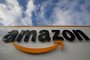 (FILES) A file photo taken on November 28, 2019  shows the Amazon logo at one of the company's centre in Bretigny-sur-Orge. - Masks for all French employees, temperature control throughout the network: the American giant of online retail group Amazon reacted on April 3, 2020 to the grumbling of its employees, without really calming concerns over the coronavirus epidemic. (Photo by Thomas SAMSON / AFP)