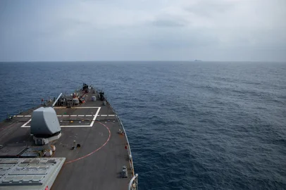 In this image obtained fro the US Department of Defense, the Arleigh Burke-class guided-missile destroyer USS Laboon approaches the oiler USNS Kanawha (background) for replenishment-at-sea operation in the Red Sea on December 25, 2023. The US Central Command said in a social media post on January 6, 2024,  that "an unmanned aerial vehicle launched from Iranian-backed Huthi-controlled areas of Yemen was shot down in self-defense" by the USS Laboon in the Red Sea. The incident came just days after a 12-nation group led by the US warned Huthi rebels in Yemen against continuing their attacks on Red Sea shipping. (Photo by Elexia Morelos / US Department of Defense / AFP) / RESTRICTED TO EDITORIAL USE - MANDATORY CREDIT "AFP PHOTO / US Department of Defense/US Navy/Mass Communication Specialist 2nd Class Elexia Morelos" - NO MARKETING NO ADVERTISING CAMPAIGNS - DISTRIBUTED AS A SERVICE TO CLIENTS<!-- NICAID(15647149) -->