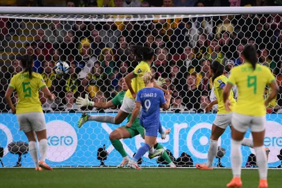 France's forward #09 Eugenie Le Sommer (C) scores her team's first goal during the Australia and New Zealand 2023 Women's World Cup Group F football match between France and Brazil at Brisbane Stadium in Brisbane on July 29, 2023. (Photo by FRANCK FIFE / AFP)<!-- NICAID(15495387) -->
