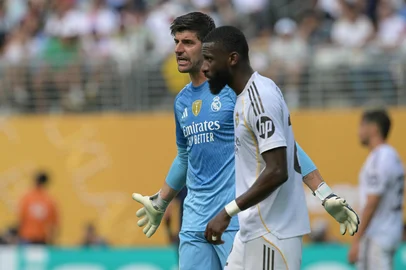 Real Madrid's Belgian goalkeeper #01 Thibaut Courtois (L) reacts past German defender #22 Antonio Ruediger (R) during the FIFA Club World Cup 2025 semifinal football match between France's Paris Saint-Germain and Spain's Real Madrid at the MetLife stadium in East Rutherford, New Jersey on July 9, 2025. (Photo by JUAN MABROMATA / AFP)<!-- NICAID(16076784) -->
