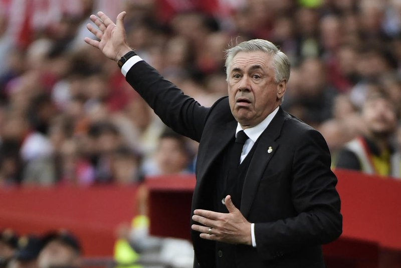 Real Madrid's Italian coach Carlo Ancelotti gestures on the sidelines during the Spanish league football match between Sevilla FC and Real Madrid CF at the Ramon Sanchez Pizjuan stadium in Seville on May 27, 2023. (Photo by CRISTINA QUICLER / AFP)<!-- NICAID(15440538) -->