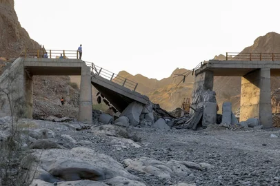 A heavily-damaged bridge which was hit by a US strike is pictured along the road connecting Roudan and Bandar Abbas in southern Iran on July 18, 2026. The United States hit Iran on July 17, with Tehran accusing US forces of striking civilians sites and drawing Iranian threats of reprisals on regional infrastructure. A battle over the strategic Strait of Hormuz has rekindled the war in the Middle East and the foes have traded fire for six days running. (Photo by Amir Hossein KHORGOOEI / ISNA / AFP) / <!-- NICAID(16329985) -->