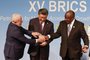 (From L to R) President of Brazil Luiz Inacio Lula da Silva, President of China Xi Jinping and South African President Cyril Ramaphosa gesture during the 2023 BRICS Summit at the Sandton Convention Centre in Johannesburg on August 23, 2023. (Photo by GIANLUIGI GUERCIA / POOL / AFP)<!-- NICAID(15518858) -->