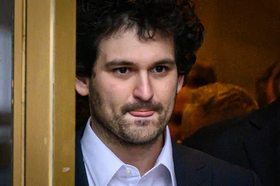 (FILES) FTX's former CEO and founder Sam Bankman-Fried leaves the courthouse following his arraignment in New York City on December 22, 2022. Disgraced cryptocurrency wunderkind Bankman-Fried was sentenced to 25 years in jail on March 28, 2024, following his conviction in one of the biggest financial fraud cases in history. (Photo by Ed JONES / AFP)<!-- NICAID(15719312) -->