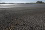 (FILES) Picture of the dried Canelon Grande reservoir just north of Canelones, in southern Uruguay, taken on March 14, 2023, as the country goes through a severe drought. The reservoir's main purpose is to supply drinking water to the Metropolitan area of Montevideo, while it is also used in irrigation systems in the area. In the first semester of 2023, Uruguay is facing a water crisis due to prolonged drought. The worst water deficit since the beginning of records 74 years ago, threatens the supply of drinking water in Montevideo and the metropolitan region, where some 1.8 million people live, more than half of the country's population. (Photo by Pablo PORCIUNCULA / AFP)<!-- NICAID(15432749) -->