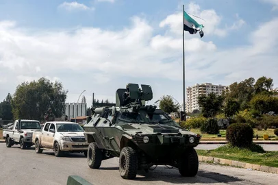 An armoured vehicle used by security forces loyal to the interim Syrian government moves along a road in Syria's western city of Latakia on March 9, 2025. Syria's interim President Ahmed al-Sharaa called for national unity and peace on March 9, amid growing international backlash following the killing of civilians along the country's coast in the worst violence since the overthrow of former president Bashar al-Assad, in the heartland of the Alawite minority to which the latter belongs.