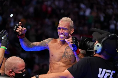 UFC 262: Oliveira v ChandlerHOUSTON, TEXAS - MAY 15: Charles Oliveira of Brazil reacts after defeating Michael Chandler in their UFC lightweight championship bout at Toyota Center on May 15, 2021 in Houston, Texas. (Photo by Josh Hedges/Zuffa LLC)Editoria: SLocal: HoustonIndexador: Josh HedgesSecao: MARFonte: Zuffa LLCFotógrafo: Contributor<!-- NICAID(15644782) -->