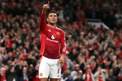 Manchester United's Brazilian midfielder #18 Casemiro celebrates after scoring Manchester United's second goal during the UEFA Europa League semi final second leg football match between Manchester United and Athletic Club Bilbao at Old Trafford stadium in Manchester, north west England, on May 8, 2025. (Photo by Oli SCARFF / AFP)<!-- NICAID(16033400) -->