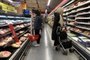 Women look at prices at a supermarket in Buenos Aires on May 11, 2023, on the eve of the publication of April's inflation by the National Institute of Statistics and Census. Argentina's National Institute of Statistics and Census announced that April's Consumer Price Index rate increased 8.4% compared to March. (Photo by STRINGER / AFP)<!-- NICAID(15428431) -->