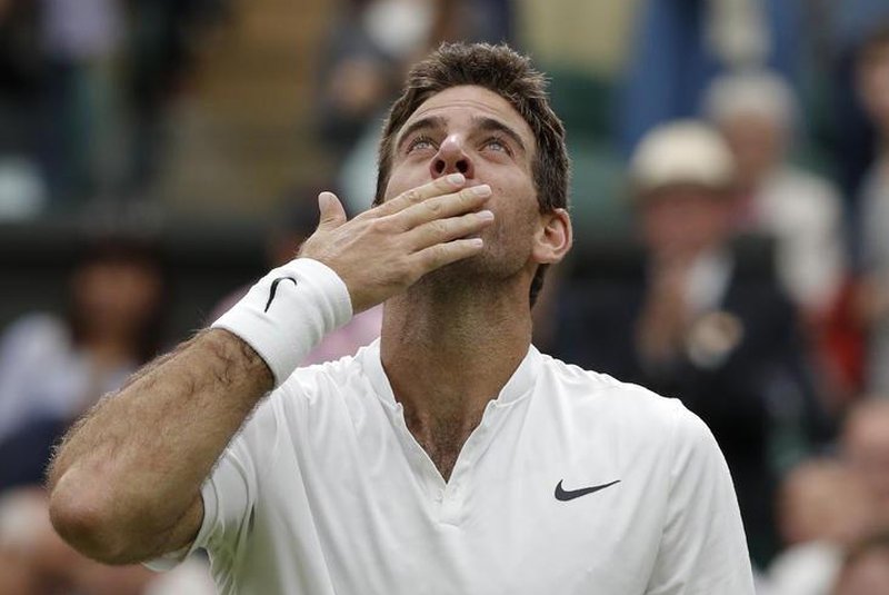 Argentina's Juan Martin del Potro celebrates beating Switzerland's Stan Wawrinka during their men's singles second round match on the fifth day of the 2016 Wimbledon Championships at The All England Lawn Tennis Club in Wimbledon, southwest London, on July 1, 2016. ADRIAN DENNIS / AFPEditoria: SPOLocal: LondonIndexador: ADRIAN DENNISSecao: tennisFonte: AFPFotógrafo: STF
